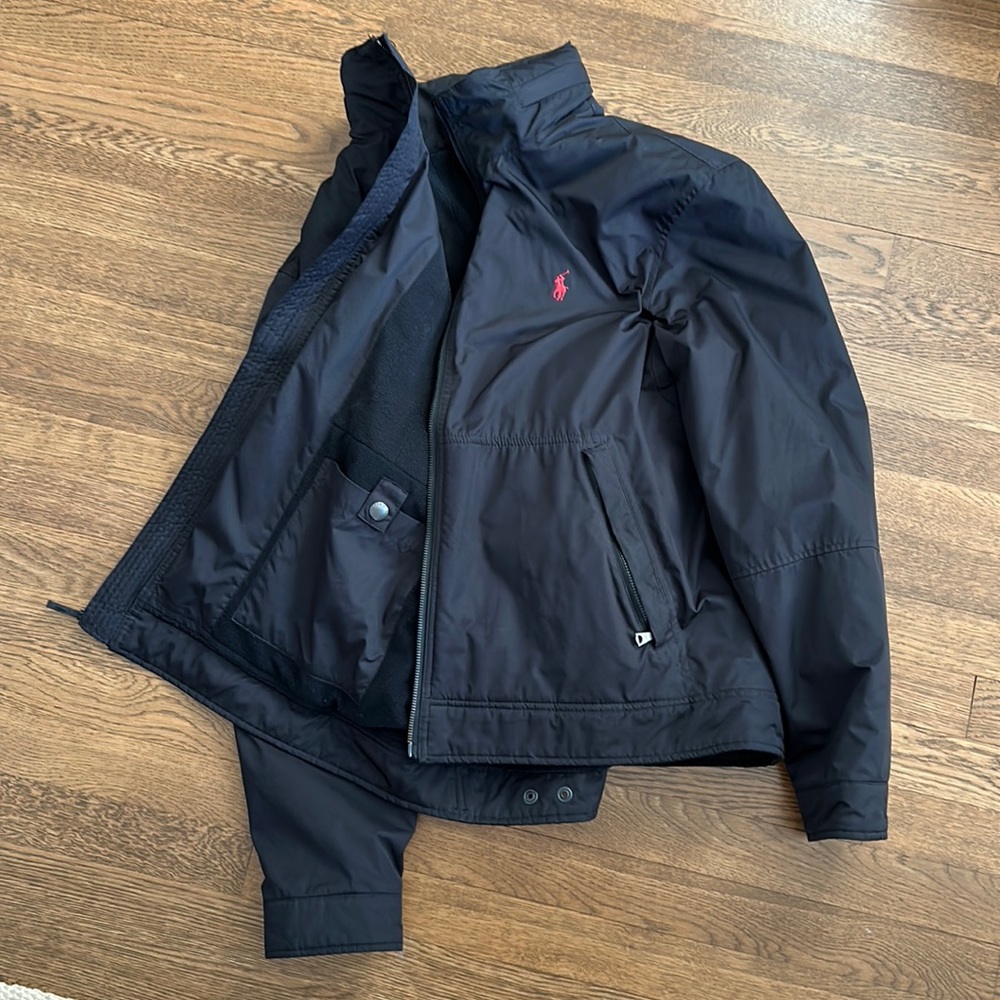 Nice black Polo jacket size Large. Fits like a large. Nice insulation.